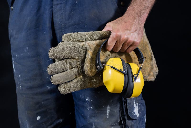 Helmet held by a construction worker. Protective clothing for ma