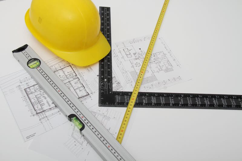 Helmet and tools for construction drawings and buildings stock images