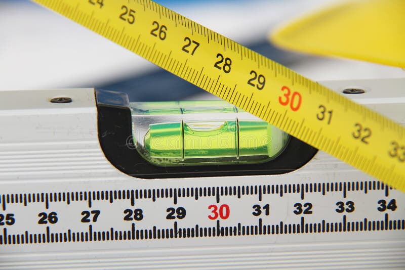 Helmets and tools for construction drawings and buildings stock photography