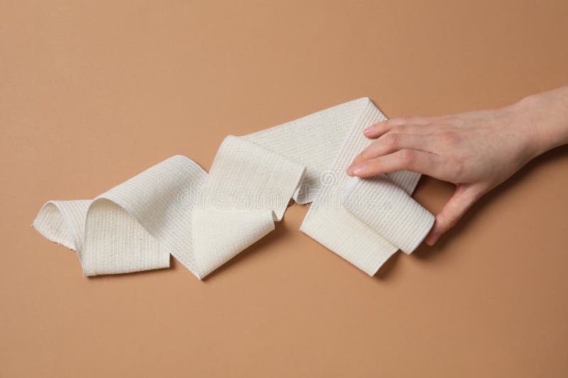 Help during an Injury, Female Hand Holds Elastic Bandage Stock Image Image of damage, gauze