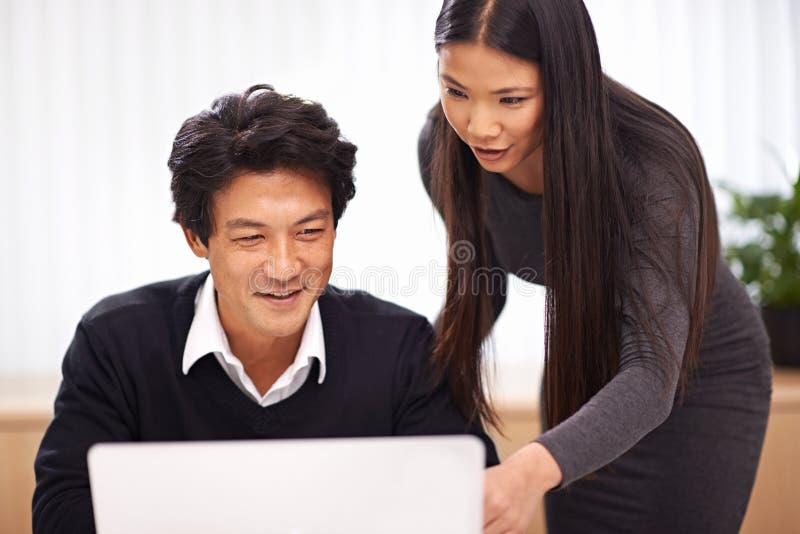 Help, mentor and teamwork on laptop in office with businessman learning from support of woman. Feedback, advice and royalty free stock image