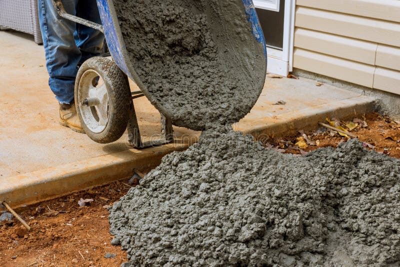With the Help of the Wheelbarrow, they are Making a New Concrete