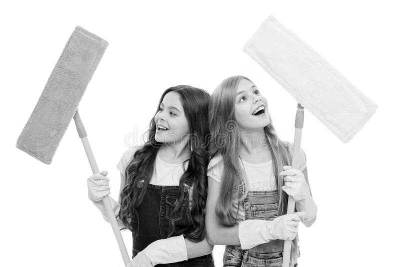 Helpful kids cleaning together. Girls with protective gloves and mops ready for cleaning. Household duties. Sisters royalty free stock photography Helpful kids cleaning together. Girls with protective gloves and mops ready for cleaning. Household duties. Sisters royalty free stock photography