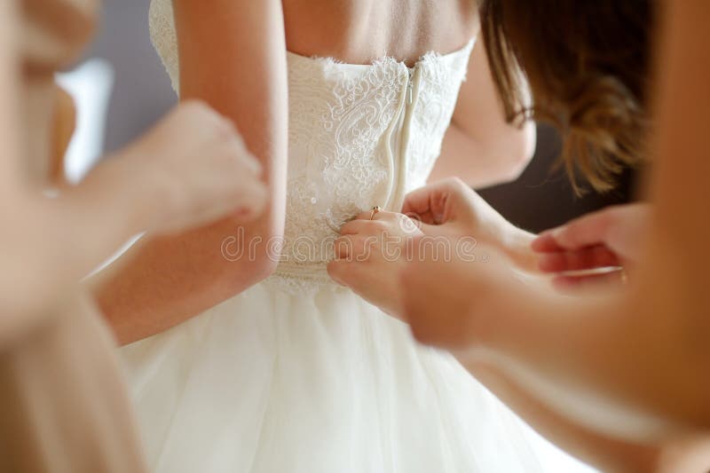 Helping the Bride To Put Her Dress on Stock Image Image of clothing, dress 26127893