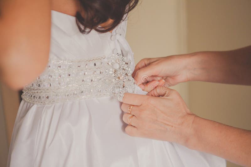 Helping the Bride To Put Her Wedding Dress on. Wedding Details Stock