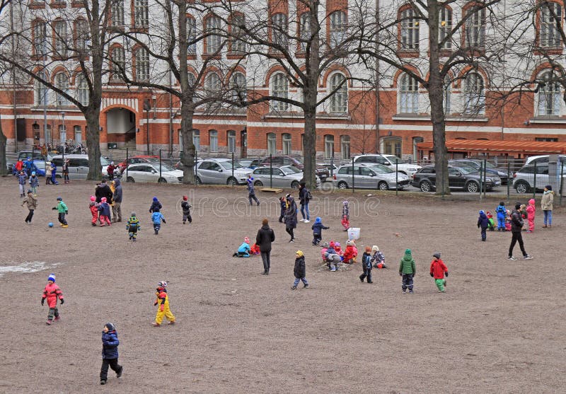 Children are playing outdoor in Helsinki, Finland