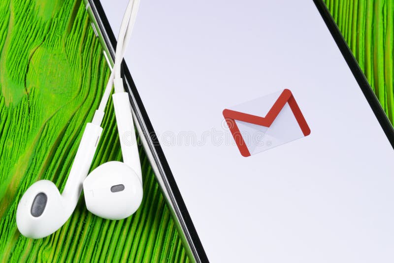 Google Gmail application icon on Apple iPhone X smartphone screen close-up. Gmail app icon. Gmail is popular Internet online e-mai royalty free stock images