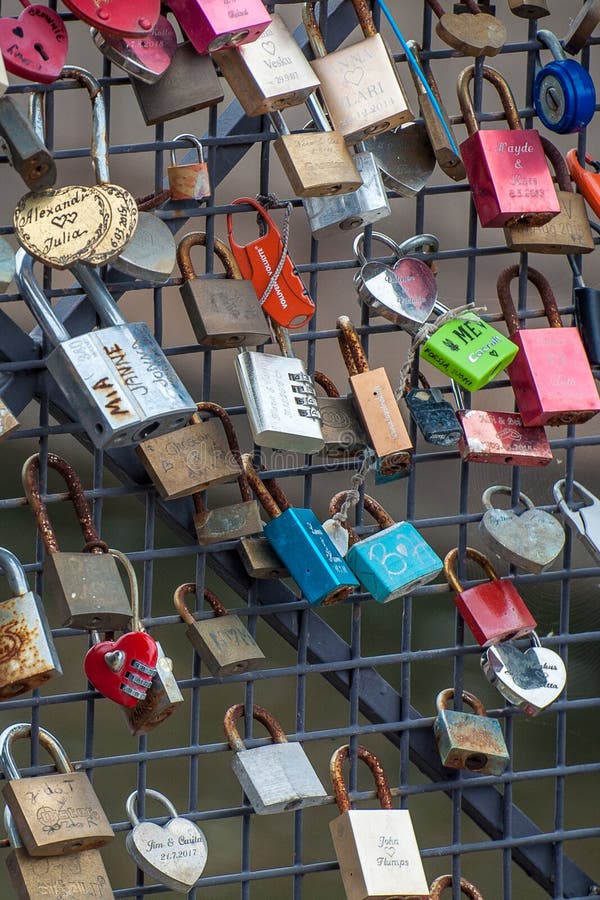 Helsinki, Finland - September 4, 2018: Bridge of love near the harbor in the center of Helsinki, padlockes with the names of stock photo Helsinki, Finland - September 4, 2018: Bridge of love near the harbor in the center of Helsinki, padlockes with the names of stock photo