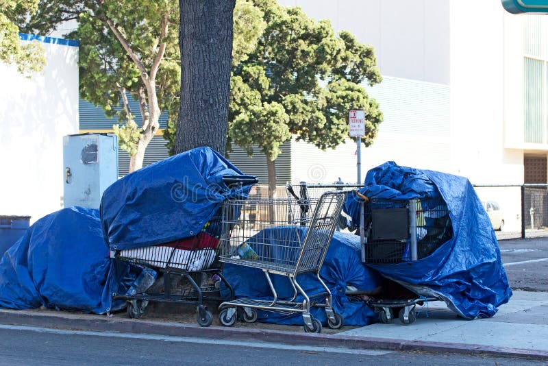 Homeless people's belongings packed in grocery carts. Homeless people's belongings packed in grocery carts