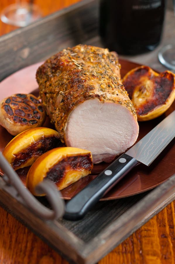 Herb Crusted Pork Loin Roast with Apples and Garlic Stock Image Image