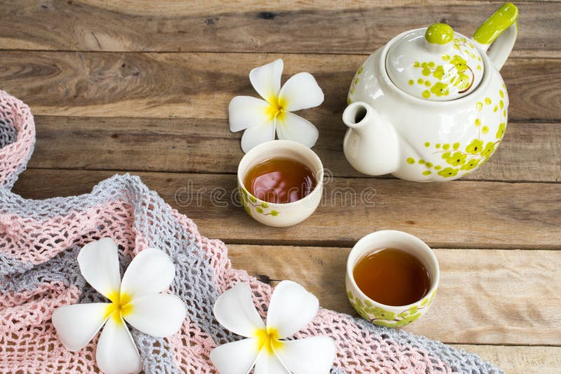 Herbal healthy drinks tea for health care sore throat with teapot ,flowers frangipani of lifestyle relax stock photos Herbal healthy drinks tea for health care sore throat with teapot ,flowers frangipani of lifestyle relax stock photos