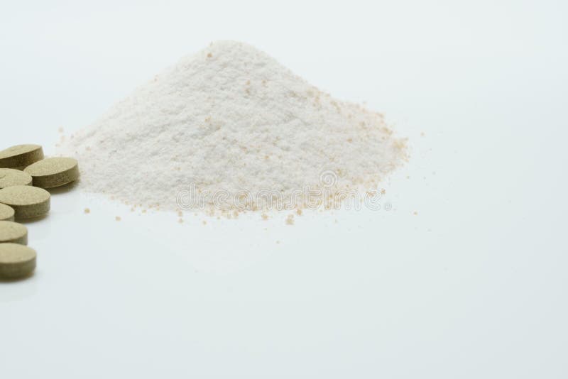 Herbal tablets and dry powder royalty free stock photo