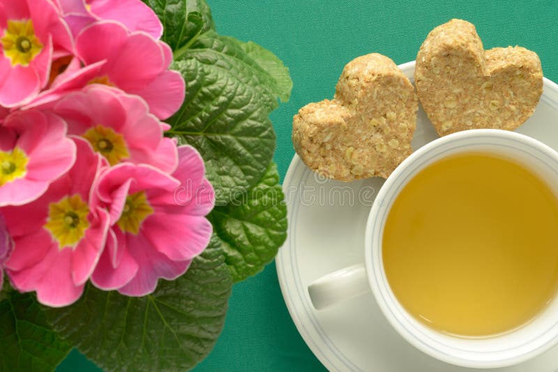 Herbal tea Heart-shaped cookies Primrose flowers