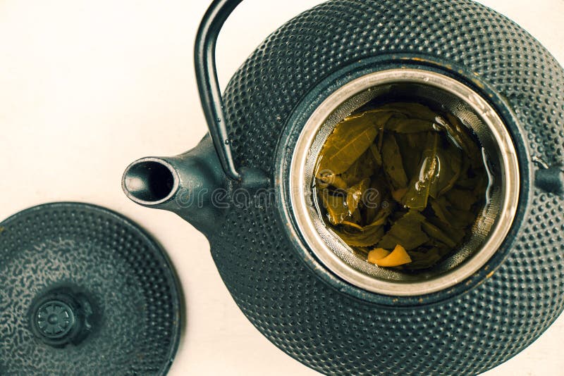 Herbal Tea, Iron Teapot and Cup of Tea on the White Background, Chinese
