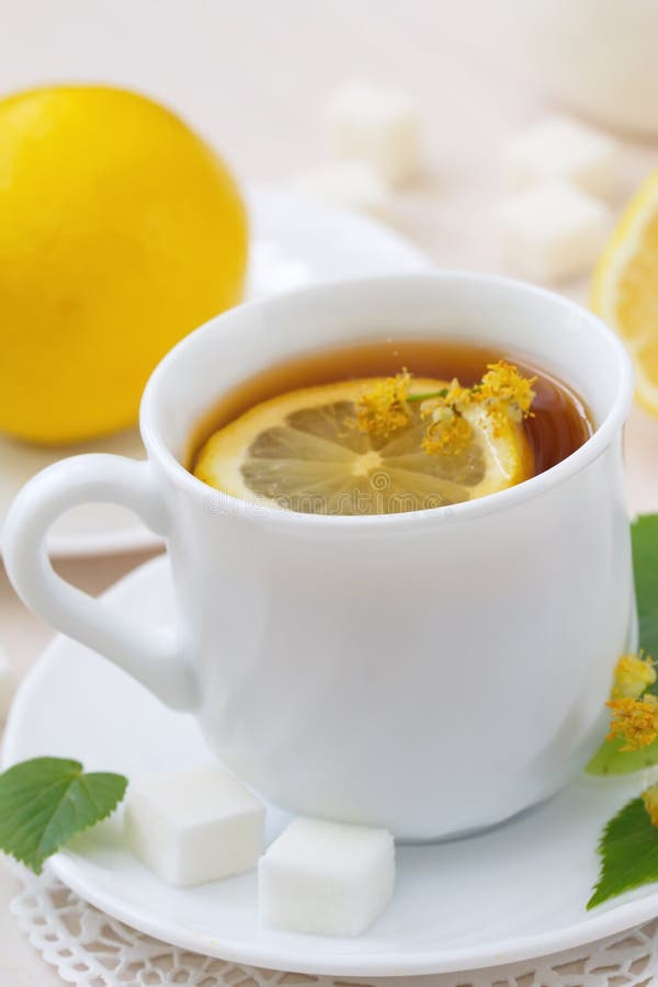 Herbal tea with linden flowers and lemon stock photo Herbal tea with linden flowers and lemon stock photo