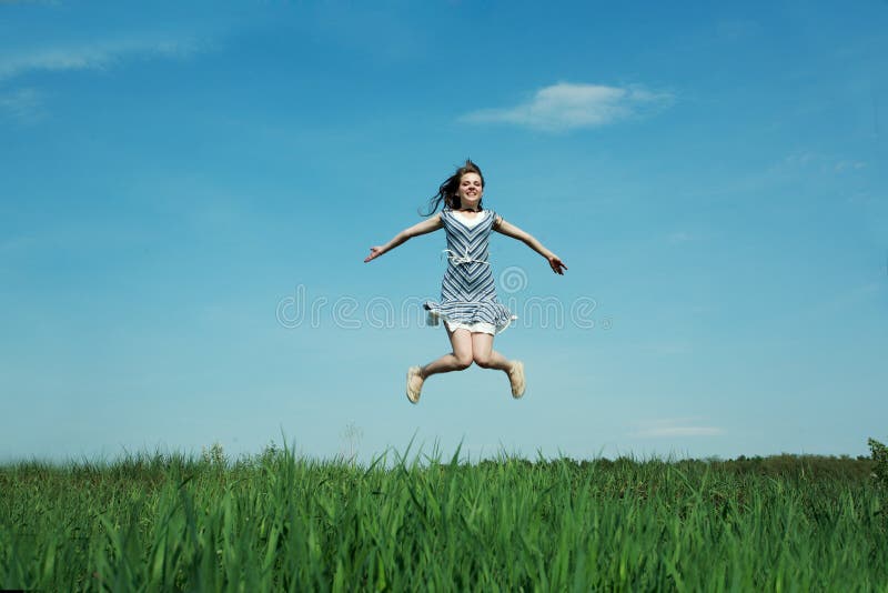 A beautiful young girl jumps. A beautiful young girl jumps