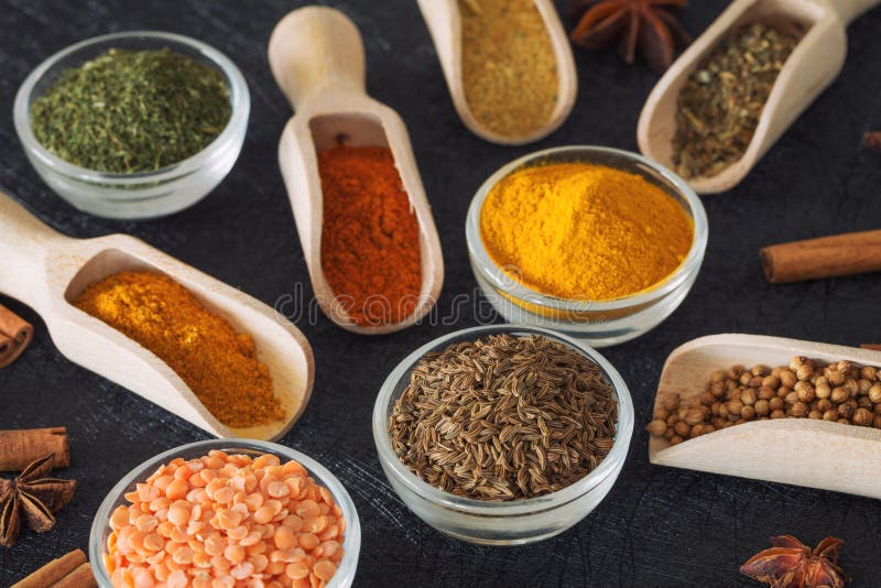 Herbs, spices and food additives on a dark background