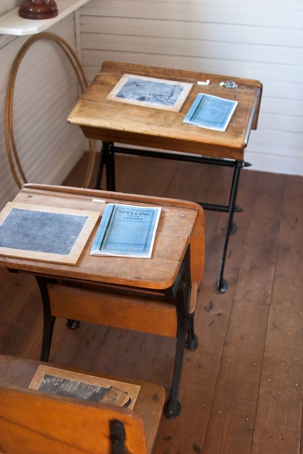 Row of heritage school desks with small chalkboards