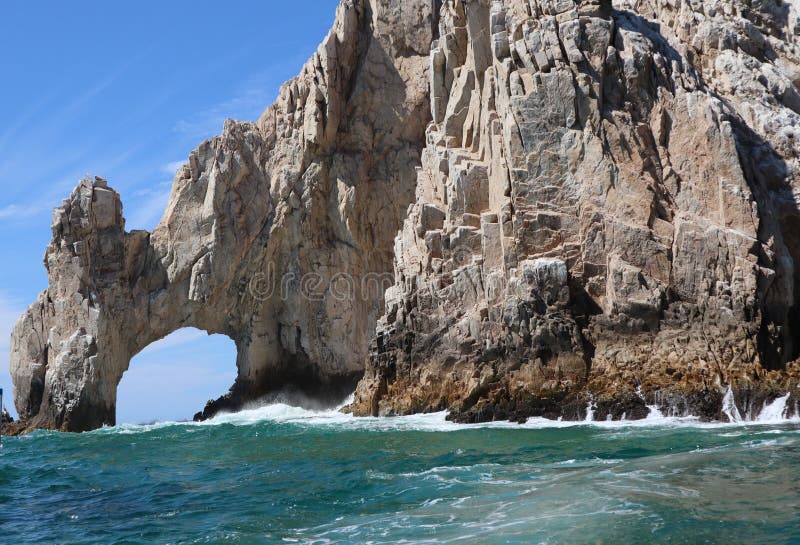 A beautiful view of The Arch, the iconic landmark along the rocky shoreline of the cape in Los Cabos. A beautiful view of The Arch, the iconic landmark along the rocky shoreline of the cape in Los Cabos