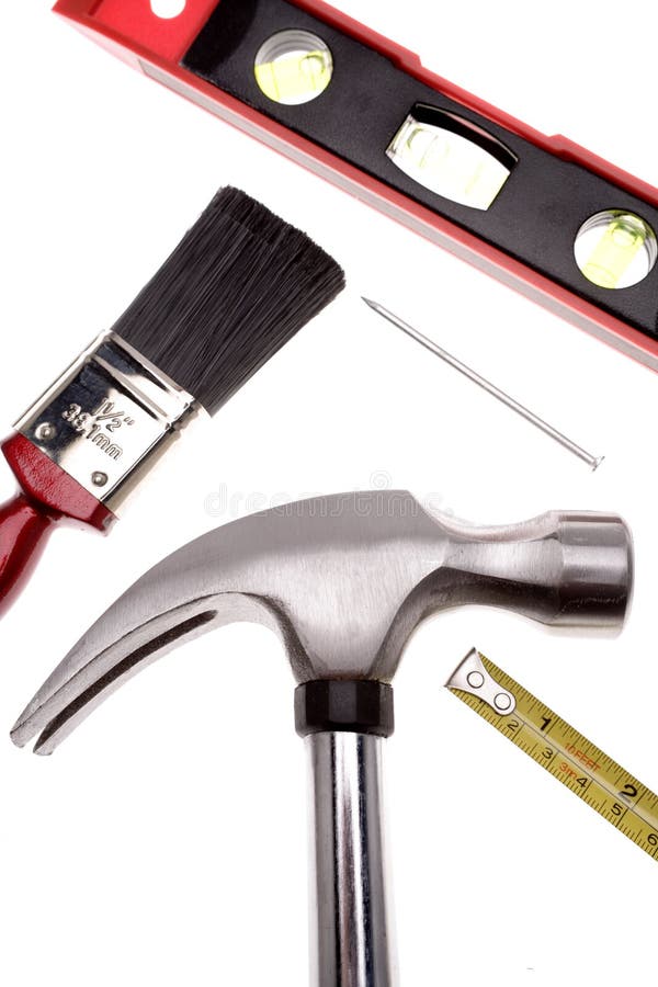 Hammer, tape measure, paintbrush, level and nail over white. Hammer, tape measure, paintbrush, level and nail over white