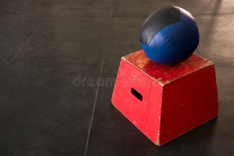 Red jump box with a navy and black medicine ball. Red jump box with a navy and black medicine ball