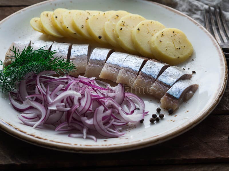 Herring Fish with Potatoes Slices and Red Onion Stock Image Image of