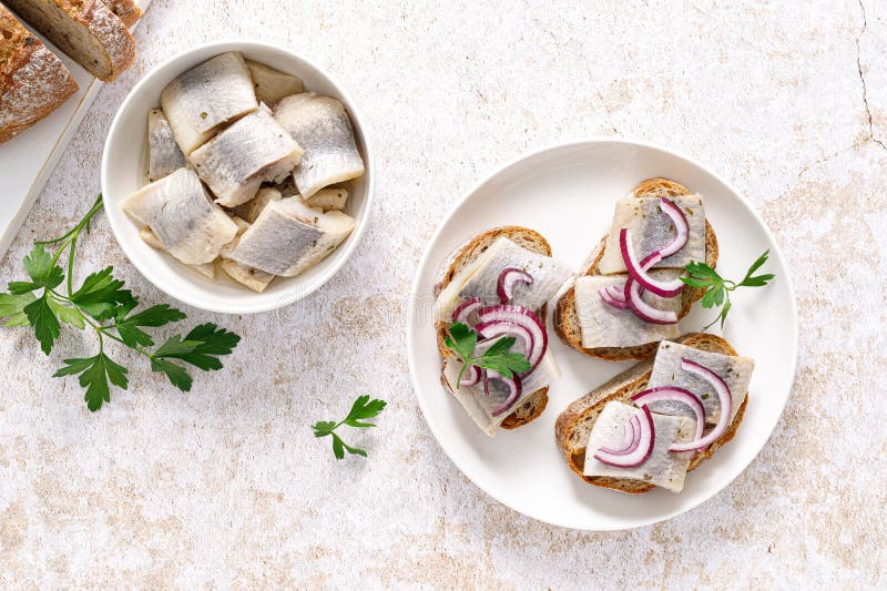 Herring Sandwich. Toast with Bread, Herring and Onion Stock Photo