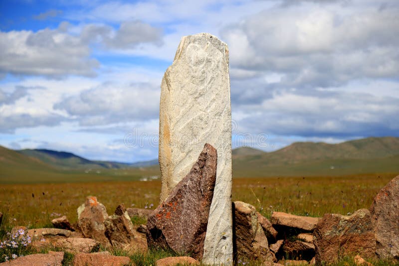 Deer stone in the Mongolian steppe. High quality photo. Deer stone in the Mongolian steppe. High quality photo