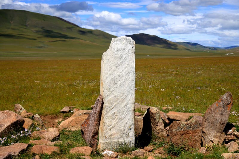 Deer stone in the Mongolian steppe. High quality photo. Deer stone in the Mongolian steppe. High quality photo