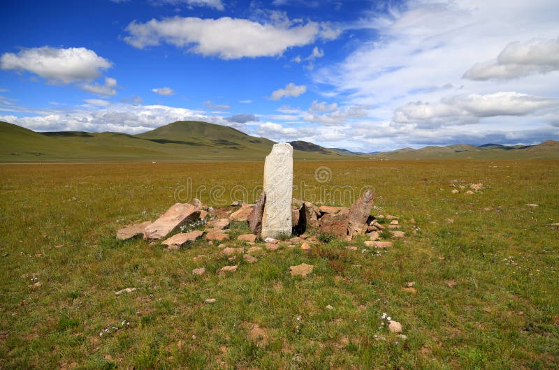 Deer stone in the Mongolian steppe. High quality photo. Deer stone in the Mongolian steppe. High quality photo