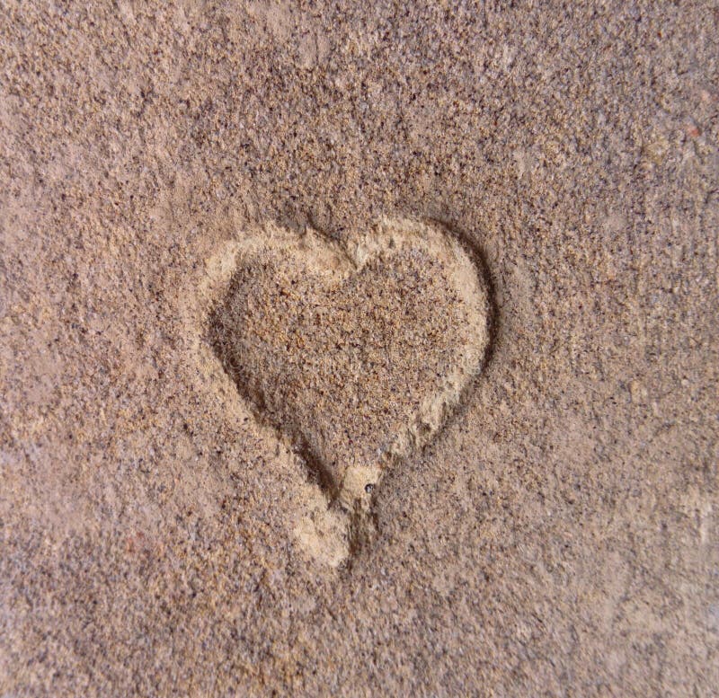 Heart shape in the old brick stone from up close. Heart shape in the old brick stone from up close