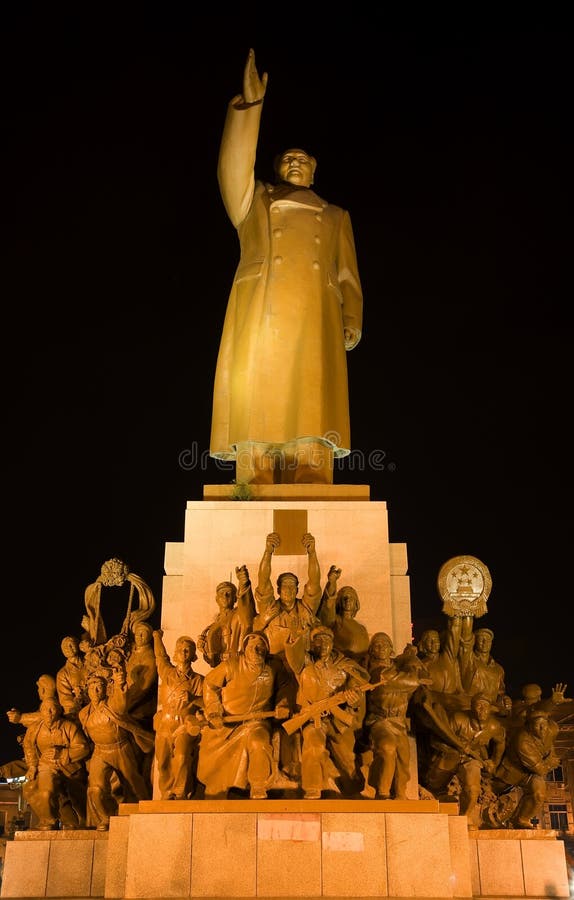 Mao Statue Heroes, Zhongshan Square, Shenyang, Liaoning Province, China at Night Lights Famous Statue built in 1969 in middle of Cultural Revolution. Hero holding up a book of Mao Zedong thought. Mao Statue Heroes, Zhongshan Square, Shenyang, Liaoning Province, China at Night Lights Famous Statue built in 1969 in middle of Cultural Revolution. Hero holding up a book of Mao Zedong thought.