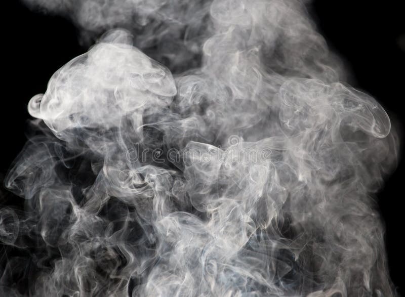 De abstracte figuur van rook op een zwarte achtergrond royalty-vrije stock afbeelding
