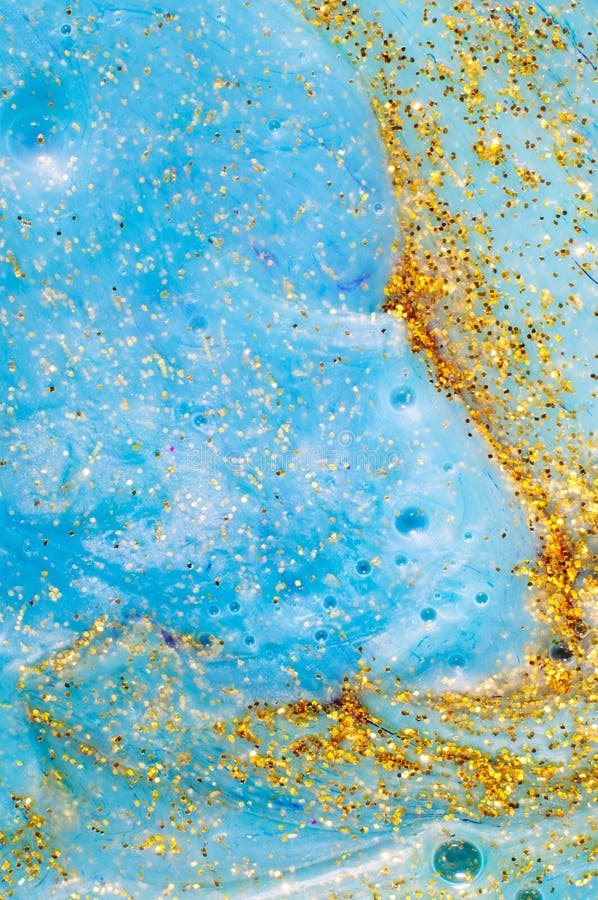 Het abstracte geweven blauwe slijm als achtergrond met gouden schittert deeltjes stock foto's Het abstracte geweven blauwe slijm als achtergrond met gouden schittert deeltjes stock foto's
