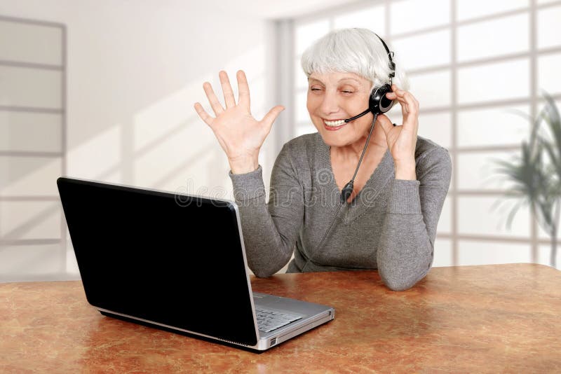 Elderly woman at the computer communicates, mother, grandmother. Elderly woman at the computer communicates, mother, grandmother.