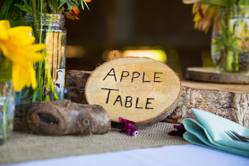 Wedding decor and decorations are made up of wildflowers and crosscut sections of fir trees at this organic natural reception in Oregon. Wedding decor and decorations are made up of wildflowers and crosscut sections of fir trees at this organic natural reception in Oregon.