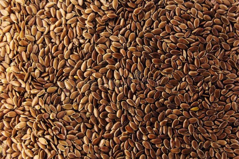 Het bruine lijnzaad geeft de achtergrond van de lijnzaadolie stock afbeelding Het bruine lijnzaad geeft de achtergrond van de lijnzaadolie stock afbeelding