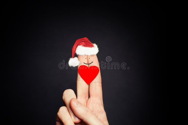 Het concept van de Kerstmisvakantie Gelukkig vingersgezicht in Santa Hats Paarverhoudingen royalty-vrije stock afbeelding Het concept van de Kerstmisvakantie Gelukkig vingersgezicht in Santa Hats Paarverhoudingen royalty-vrije stock afbeelding