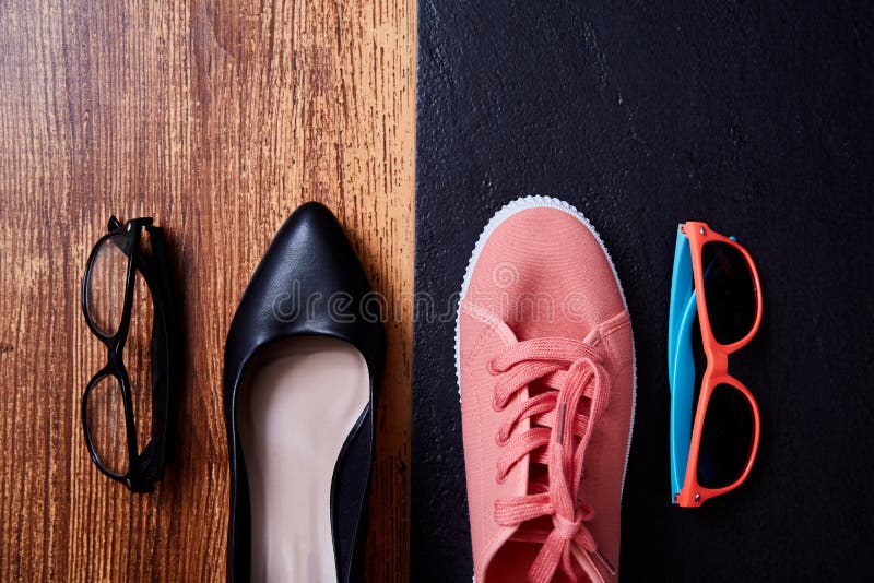 Work life balance choice concept: colored sneakers or sports shoes and strict office shoes,. Work life balance choice concept: colored sneakers or sports shoes and strict office shoes,