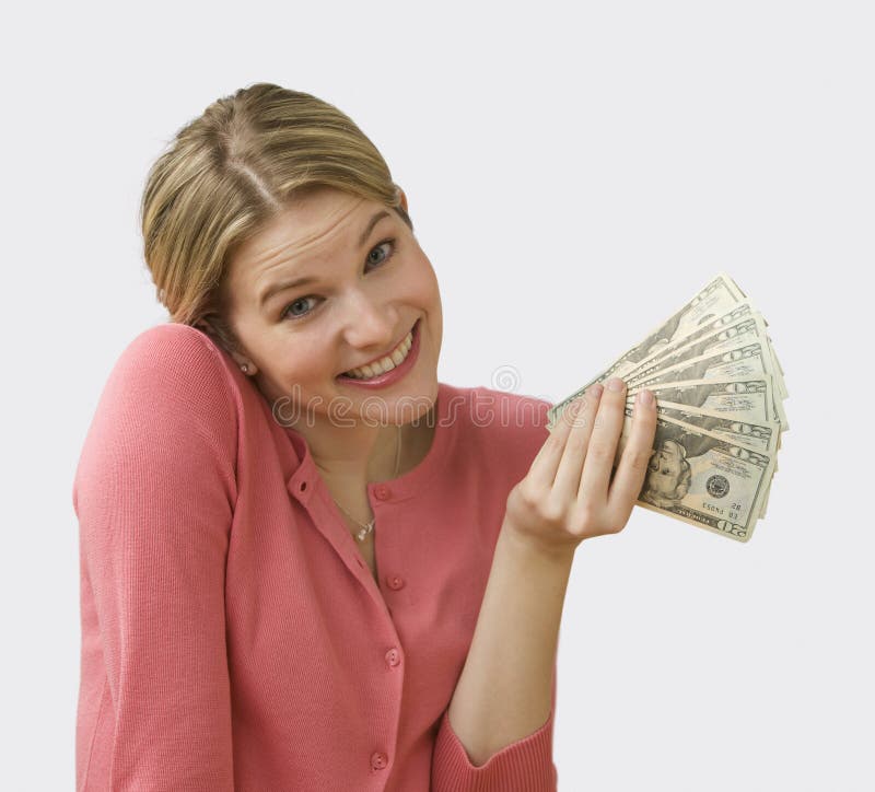 Het Contante geld van de Holding van de vrouw stock fotografie Het Contante geld van de Holding van de vrouw stock fotografie