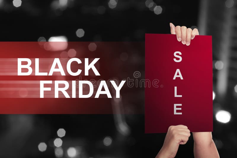 Het document van de handholding met verkooptekst op Black Friday stock afbeelding Het document van de handholding met verkooptekst op Black Friday stock afbeelding