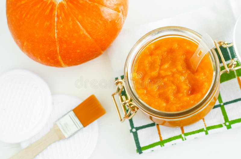 Homemade pumpkin face mask in a glass jar. DIY cosmetics and spa. Copy space. Homemade pumpkin face mask in a glass jar. DIY cosmetics and spa. Copy space.