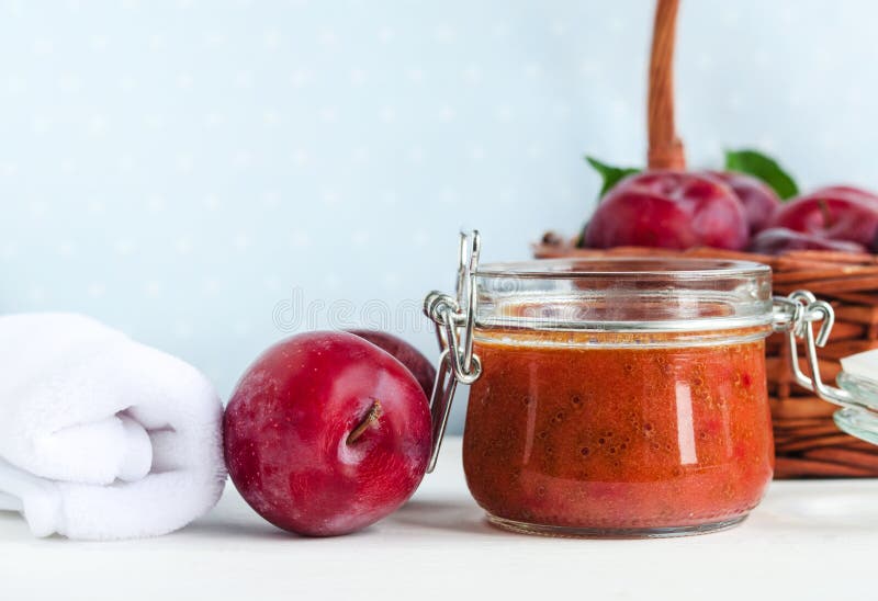 Homemade plum smoothie face and body mask/scrub in a glass jar. DIY cosmetics and spa. Copy space. Homemade plum smoothie face and body mask/scrub in a glass jar. DIY cosmetics and spa. Copy space.