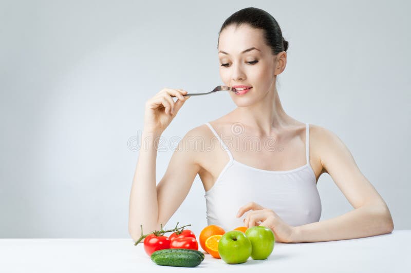 Het eten van gezond voedsel royalty-vrije stock afbeelding Het eten van gezond voedsel royalty-vrije stock afbeelding