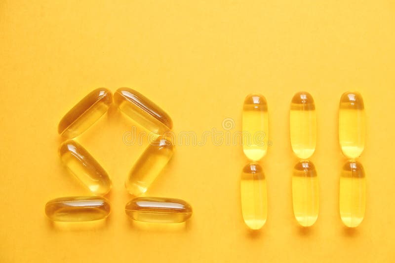 Het gele voedingshoogtepunt van supplementpillen van Omega 3 vetzuren