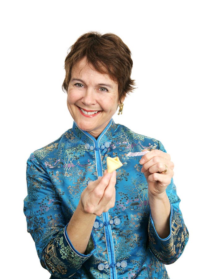 A pretty woman in a chinese blouse happy with the fortune she just got in her cookie. Isolated on white. A pretty woman in a chinese blouse happy with the fortune she just got in her cookie. Isolated on white.