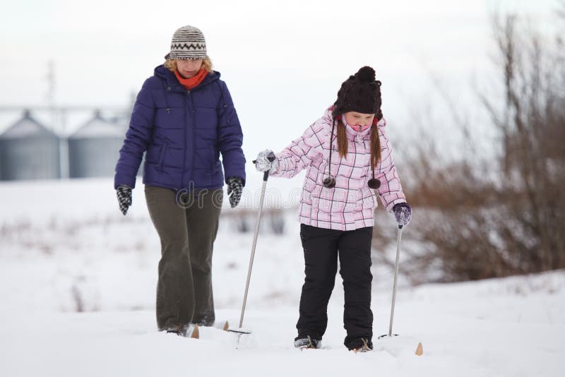 Family enjoying cross-country skiing. Family enjoying cross-country skiing