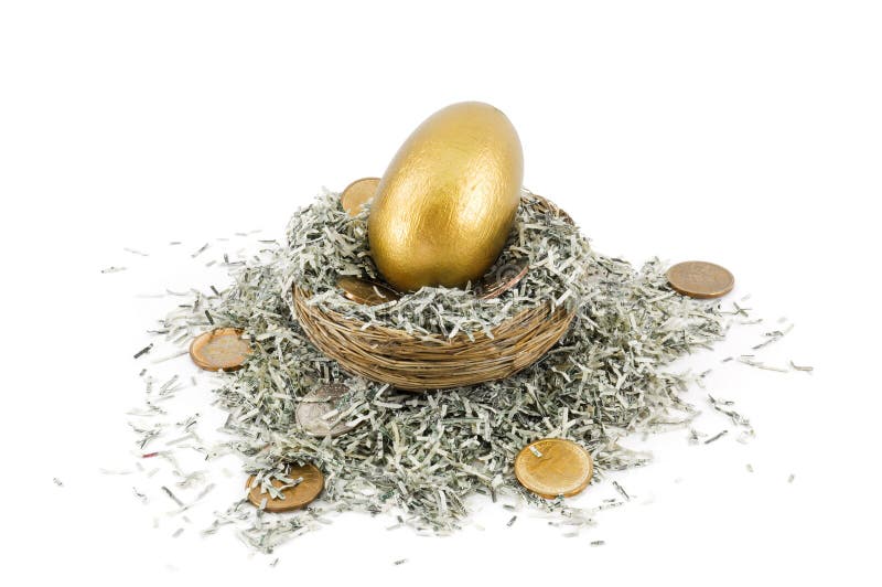 Golden nest egg - golden egg sits in nest amongst shredded US paper bills and US dollar coins. Golden nest egg - golden egg sits in nest amongst shredded US paper bills and US dollar coins