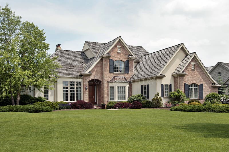 Large luxury brick home in suburban setting. Large luxury brick home in suburban setting