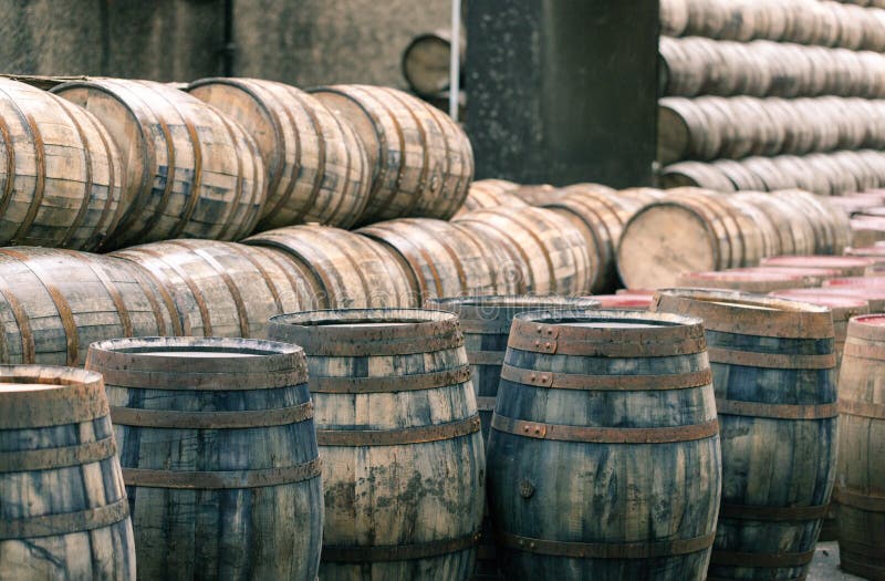 Whisky barrels full of whiskey in Scottish small traditional distillery. Whisky barrels full of whiskey in Scottish small traditional distillery